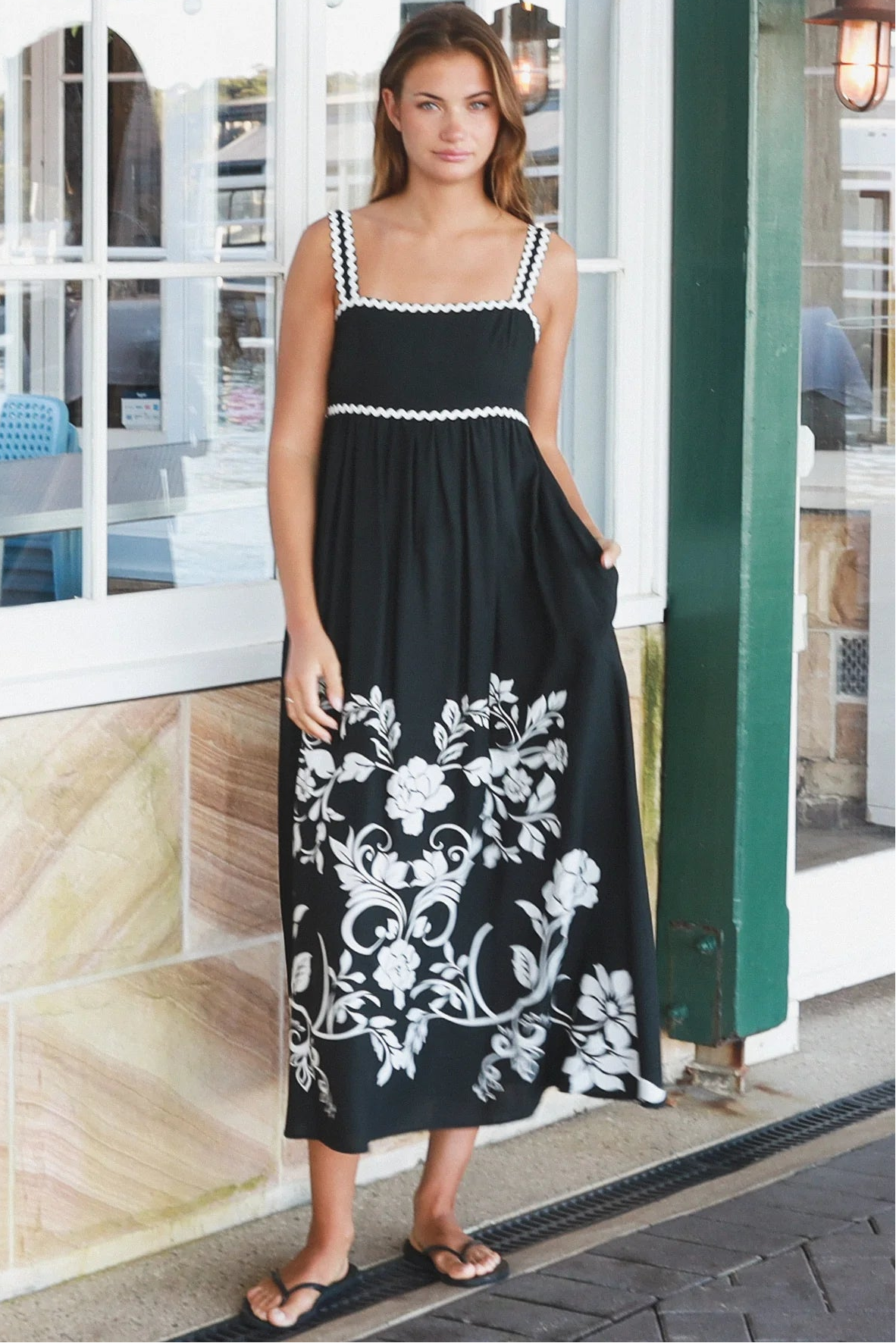 Black and white floral rayon maxi dress with tie-back detail against a black base styled for Australian boho fashion