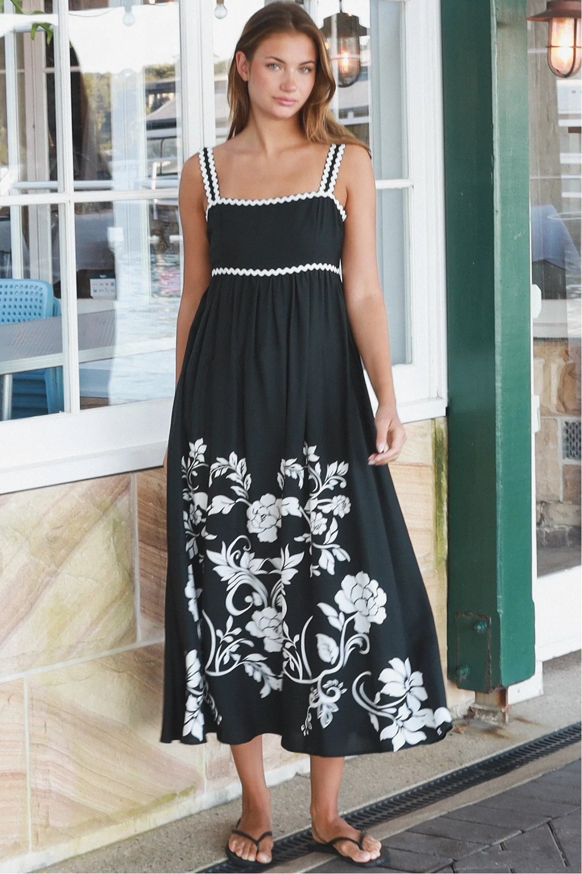 Black and white floral rayon maxi dress with tie-back detail against a black base styled for Australian boho fashion