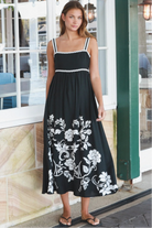 Black and white floral rayon maxi dress with tie-back detail against a black base styled for Australian boho fashion
