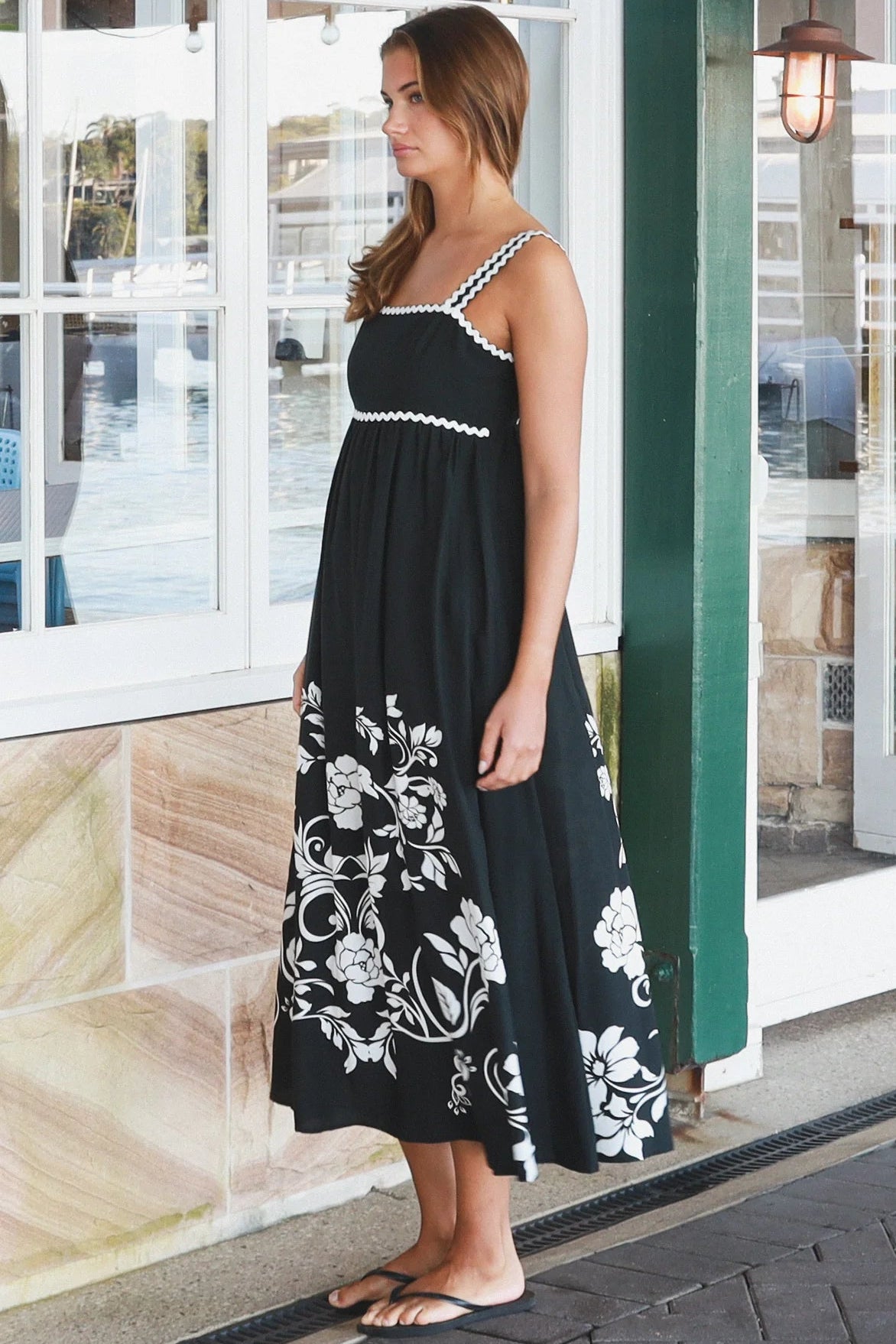 Black and white floral rayon maxi dress with tie-back detail against a black base styled for Australian boho fashion