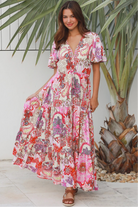 Pink paisley bohemian maxi dress with flutter sleeves, drawstring waist and tiered hem in softly draped rayon. Boho Dresses Australia.