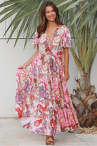Pink paisley bohemian maxi dress with flutter sleeves, drawstring waist and tiered hem in softly draped rayon. Boho Dresses Australia.