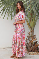 Pink paisley bohemian maxi dress with flutter sleeves, drawstring waist and tiered hem in softly draped rayon. Boho Dresses Australia.