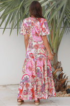 Pink paisley bohemian maxi dress with flutter sleeves, drawstring waist and tiered hem in softly draped rayon. Boho Dresses Australia.