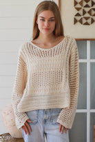 Cream crochet knit sweater with open weave relaxed fit boho top Australia styled with light wash denim jeans