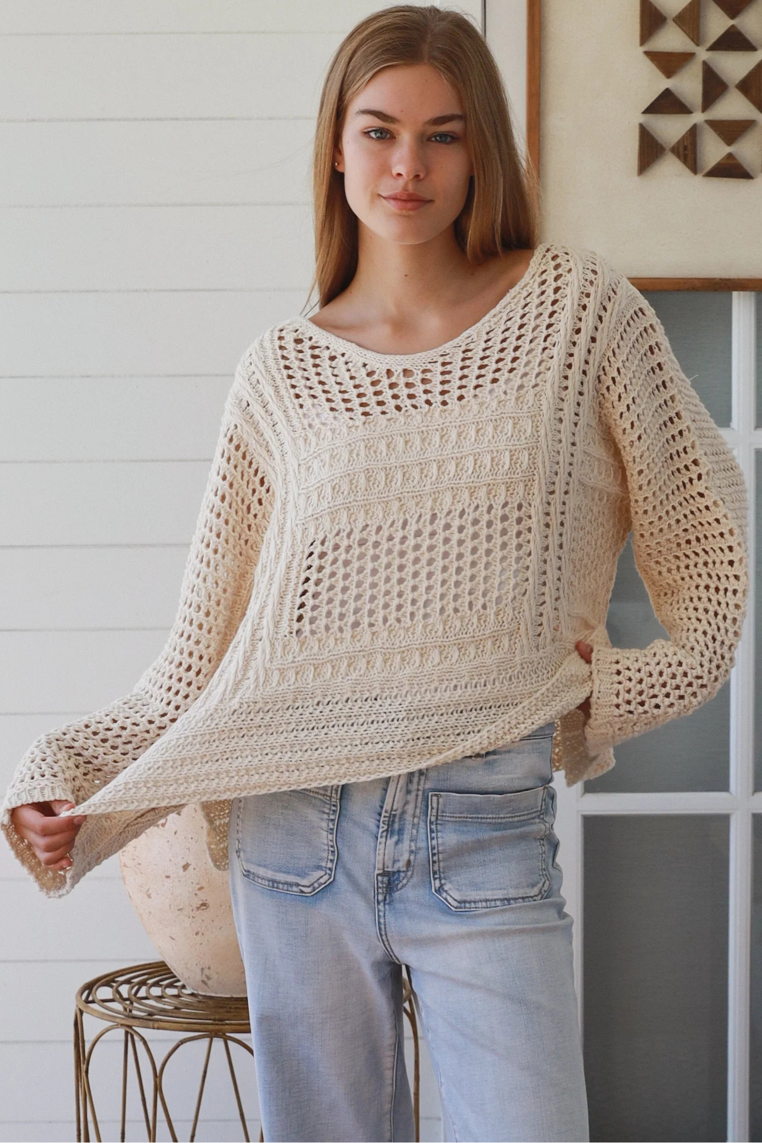 Cream crochet knit sweater with open weave relaxed fit boho top Australia styled with light wash denim jeans