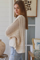 Cream crochet knit sweater with open weave relaxed fit boho top Australia styled with light wash denim jeans