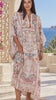 Model in motion wearing the Mirage Desert Bloom boho kaftan in ivory, terracotta and teal viscose crepe with rhinestone detail | Bohemian Love Runway