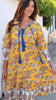 Model in motion wearing the Golden Dahlia Peacock Feather indian cotton boho dress with cobalt tassels and ornate floral border print at Bohemian Love Runway