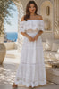 Model in motion wearing Rose white embroidered cotton maxi dress with off-shoulder floral lace, tiered skirt and scalloped rose hem