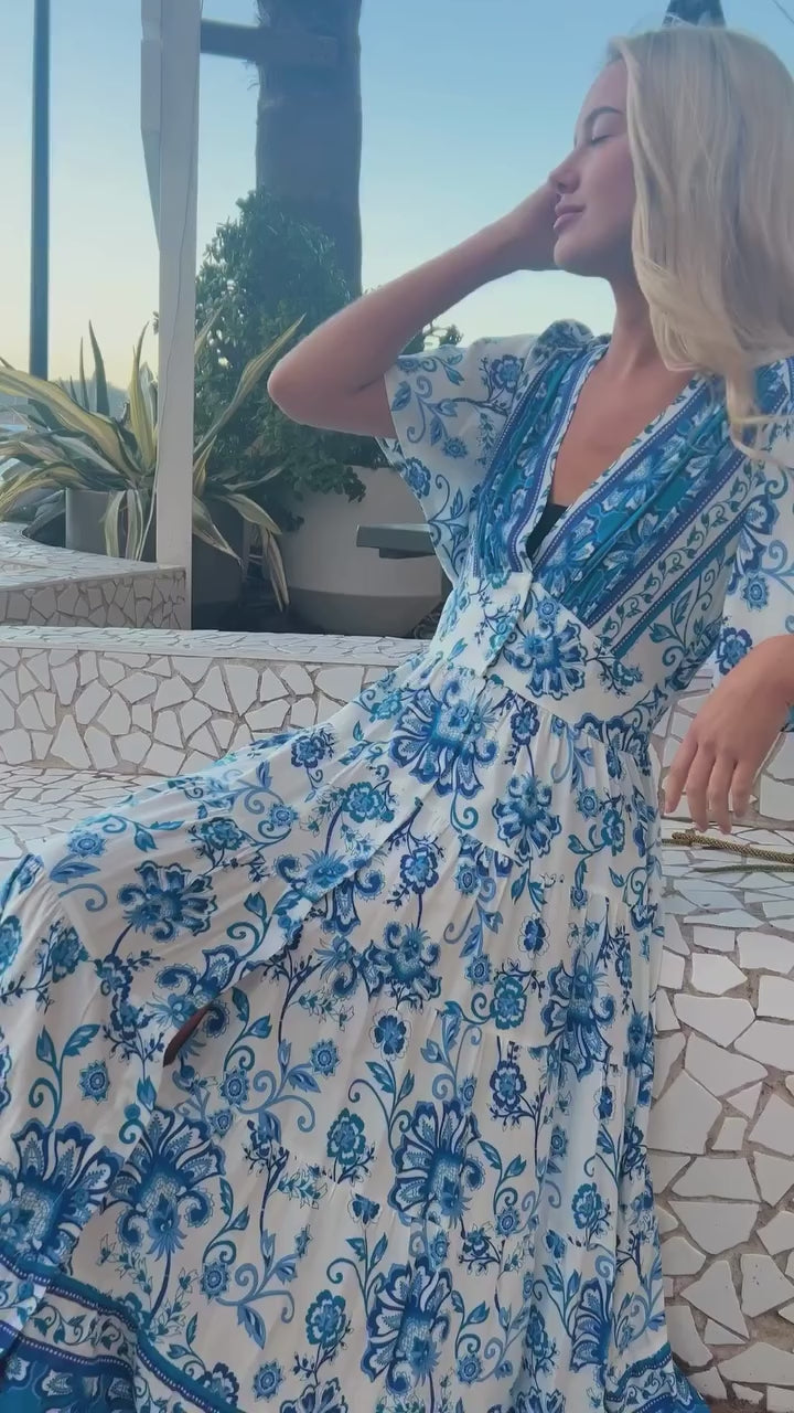 Woman twirling in a blue floral bohemian midi dress outdoors - Boho Midi Dresses Australia.