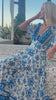 Woman twirling in a blue floral bohemian midi dress outdoors - Boho Midi Dresses Australia.