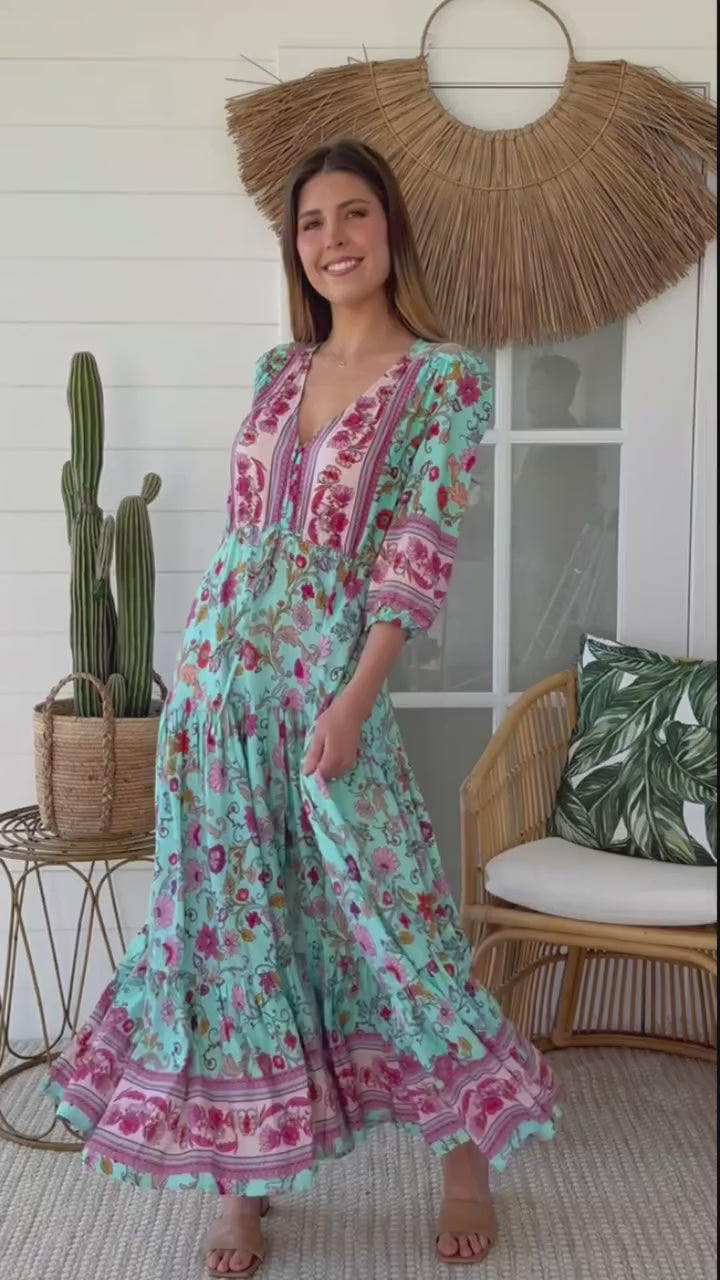 Woman twirling in the Morning Meadows Boho Maxi Dress in turquoise green with floral print - bohemian fashion Australia