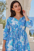 Model in motion wearing the Emerson Cotton Maxi Dress Rory Blue with vintage blue floral print, button front, tassel drawstring waist and tiered skirt | Bohemian Love Runway 