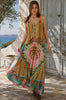 Model in motion wearing the Amara floral boho maxi skirt in 100% rayon with colourful placement print, gathered frill hem and tassel tie from Bohemian Love Runway.