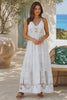 Model in motion wearing the Alexandra white embroidered cotton maxi dress with tiered skirt | Shop Bohemian Love Runway Australia