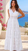 Model in motion wearing the Demi white embroidered cotton boho maxi dress with crochet lace by Salty Palm at Bohemian Love Runway