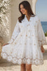 Model wearing the Honeyed Garden white cotton embroidered mini dress with floral cutwork hem and sleeves at Bohemian Love Runway