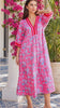 Model in motion wearing the Sanctuary Pluto Pink cotton boho midi dress with turquoise wildlife block print, V-neckline and contrast trim | Bohemian Love Runway