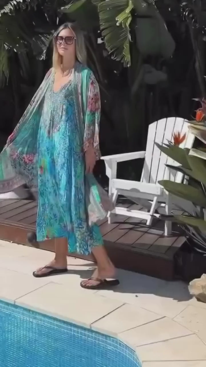 Woman in boho kimono and maxi dress walking poolside. Summer Boho Clothing Australia