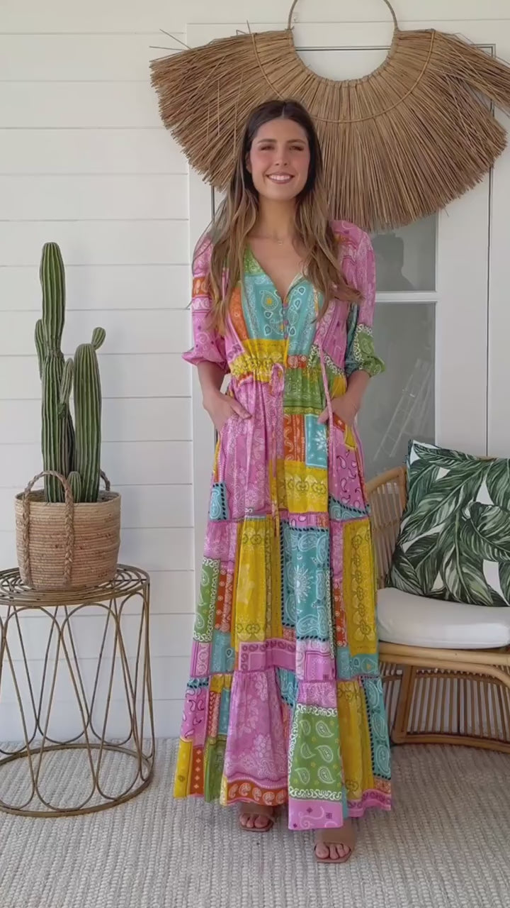 Woman twirling in the Amour Patchwork Maxi Dress with paisley boho print in pink and turquoise - bohemian style Australia