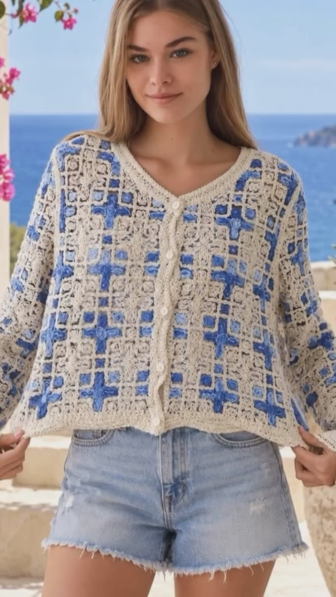 Model in motion wearing the Blue and ivory Sol cotton crochet boho cardigan with intricate open weave, V-neck, buttons and scalloped edging | Bohemian Love Runway 