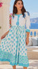 Model in motion wearing the Lovebird Cotton Midi Dress Blue by Peacock Feather, white cotton boho midi dress with blue floral and border prints | Bohemian Love Runway