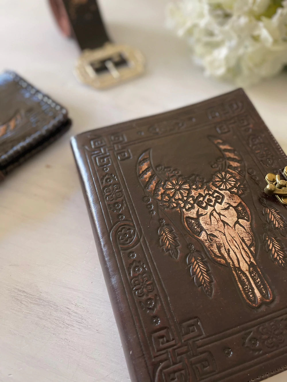  Dark leather journal with hand-tooled bull skull design on woven mat - Gypsy Toro boho journal from Bohemian Love Runway 